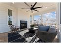 Comfortable screened porch offers modern fireplace and backyard views at 2644 Catheys Creek Cir, Wendell, NC 27591
