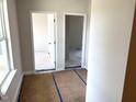 Entryway with two open doorways revealing spacious rooms and natural light at 316 Olivia Crossing Ct # 11, Four Oaks, NC 27524