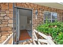 Inviting entryway with stone facade and a glimpse of the cozy living room at 3622 Colchester St # 13, Durham, NC 27707