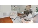 Bright living room with hardwood floors, neutral decor, and stylish furnishings at 3622 Colchester St # 13, Durham, NC 27707