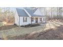 Beautiful home with stylish exterior, complemented by a well-manicured lawn at 5171 S River Rd, Lillington, NC 27546