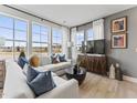 Inviting living room with abundant natural light, comfortable seating, and contemporary decor with stylish furniture at 10529 Pleasant Branch Dr # 101, Raleigh, NC 27614