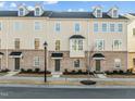 Well-maintained townhomes with landscaped yards, dormer windows and convenient street access at 1414 Excelsior Grand Ave, Durham, NC 27713