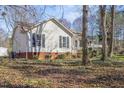 Exterior view of the home highlighting its design, with a mix of brick foundation and siding at 152 Rynal Dr, Garner, NC 27529
