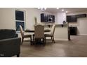 Cozy dining area adjacent to the kitchen with seating for four at 3724 Josiah Ct, Nashville, NC 27856