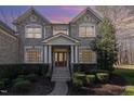 Stately brick home with covered entryway and well-maintained landscaping at 4009 Brittabby Ct, Raleigh, NC 27606