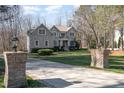 Well maintained front yard with large driveway leading to a beautiful home at 4009 Brittabby Ct, Raleigh, NC 27606