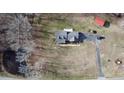 Bird's eye view displays the home and its private location surrounded by mature trees at 466 Oren Gaines Rd, Goldston, NC 27252
