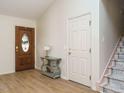 Bright foyer features wood-look flooring and staircase to the second floor at 504 Forrest Dr, Sanford, NC 27330