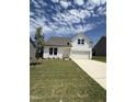 Beautifully landscaped new construction home with a two-car garage and inviting curb appeal at 556 Winding Creek Dr Dr, Lillington, NC 27546