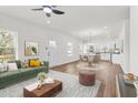 Inviting living room with wood floors, bright windows, modern furniture, and a cozy atmosphere at 603 Lee St, Burlington, NC 27217
