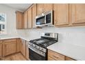 Modern kitchen with quartz countertops and stainless-steel appliances at 608 Hyperion Aly, Wake Forest, NC 27587