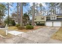 Charming two-story home with a driveway and a two-car garage at 7612 Harps Mill Rd, Raleigh, NC 27615