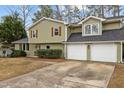 Charming two-story home with a driveway and a two-car garage at 7612 Harps Mill Rd, Raleigh, NC 27615