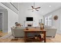 Spacious living room features high ceilings and a cozy fireplace at 818 Cabin Creek, Pittsboro, NC 27312