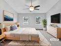 This is a bedroom with a ceiling fan, light, and windows at 1009 Bittbourg Ln, Wendell, NC 27591