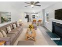 Cozy living room with a fireplace and an open view into the kitchen at 1009 Bittbourg Ln, Wendell, NC 27591