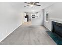 Bright living room with a fireplace and seamless flow to the adjacent kitchen area at 1009 Bittbourg Ln, Wendell, NC 27591