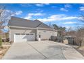 Spacious home with three car garage and large driveway at 1100 Kingwood Dr, Raleigh, NC 27609