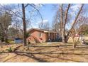 A view of the exterior showcasing the home's design, back yard, and surroundings at 114 Evelyn Dr, Knightdale, NC 27545