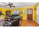 Bright living room with hardwood floors, fireplace, and comfortable seating at 114 Evelyn Dr, Knightdale, NC 27545
