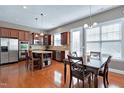 Gourmet kitchen featuring stainless steel appliances, granite countertops, and a large island at 2109 Royal Berry Ct, Cary, NC 27511