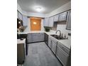 Well-lit kitchen featuring modern appliances, stylish countertops, and updated cabinets at 4100 Five Oaks Dr # 50, Durham, NC 27707