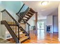 Bright living room featuring hardwood floors, fireplace, and sliding glass doors to the outdoor at 4100 Five Oaks Dr # 50, Durham, NC 27707