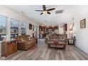 Open concept living room boasts wood floors and a seamless flow into the kitchen and dining area at 4204 Vineyard Ridge Dr, Zebulon, NC 27597