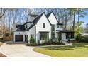 Striking new construction home features an attached garage, walkway, and neatly manicured landscaping at 4208 Windsor Pl, Raleigh, NC 27609