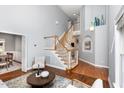 Bright living room with vaulted ceiling, hardwood floors, a staircase and natural light at 5915 Eaglesfield Dr, Raleigh, NC 27613