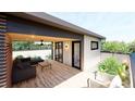 Comfortable rooftop deck featuring wood flooring, a ceiling fan, outdoor furniture, and garden views at 615 Velma Hopkins Ln, Raleigh, NC 27603