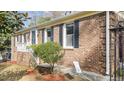 Classic brick home with manicured landscaping and inviting entryway at 6404 Dixon Dr, Raleigh, NC 27609