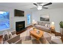 Comfortable staged living room featuring a fireplace and stylish decor at 900 Oakwater Dr, Garner, NC 27529