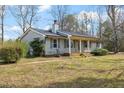 Lovely single-story home featuring a welcoming front porch and well-maintained landscaping at 245 Cedar Crk Rd, Franklinton, NC 27525