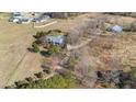 Expansive lot showcasing lush trees around the property with a large side lot at 2490 Earpsboro Rd, Zebulon, NC 27597