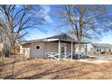 A single-story house featuring a side entrance and a well-maintained outdoor space at 2867, 2851 Nc-210 & Galilee Hwy, Smithfield, NC 27577