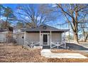 Charming house with a covered front porch, inviting entrance, and well-maintained yard at 2867, 2851 Nc-210 & Galilee Hwy, Smithfield, NC 27577