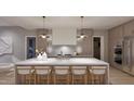 Modern kitchen with stainless steel appliances, a large center island with seating, and stylish pendant lighting at 4308 Windsor Pl, Raleigh, NC 27609