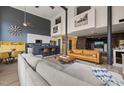 Open living space with modern kitchen, exposed beams, tall ceilings and a mix of textures at 614 Capital Blvd # 229, Raleigh, NC 27603