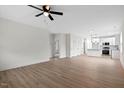 Spacious living room with modern flooring flowing into an open kitchen area at 704 East St, Smithfield, NC 27577
