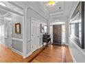 Elegant foyer with hardwood floors, archway, and decorative trim at 101 Mantle Dr, Clayton, NC 27527