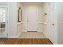 Inviting entryway featuring tile flooring, neutral walls, and access to multiple rooms at 1013 Thistle Briar Pl, Cary, NC 27511
