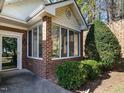 Bright sunroom with brick accents, large windows, and plenty of natural light at 1013 Thistle Briar Pl, Cary, NC 27511