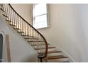 Classic wooden staircase with white risers and decorative banister at 1101 Sunset Ave, Rocky Mount, NC 27804