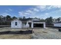 New home under construction, with a yard and an open garage showcasing an unfinished home at 178 Gobbler Dr, Smithfield, NC 27577