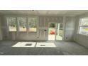 Bright living room features abundant natural light with sliding glass door to backyard at 178 Gobbler Dr, Smithfield, NC 27577