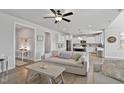 Open-concept living area flowing into a kitchen with ample natural light at 1872 Stagecoach Trl, Wendell, NC 27591
