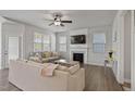 Bright living room featuring fireplace, TV, and comfortable seating at 1872 Stagecoach Trl, Wendell, NC 27591