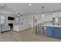 The spacious open-concept combines the kitchen, living room, and dining area at 1872 Stagecoach Trl, Wendell, NC 27591
